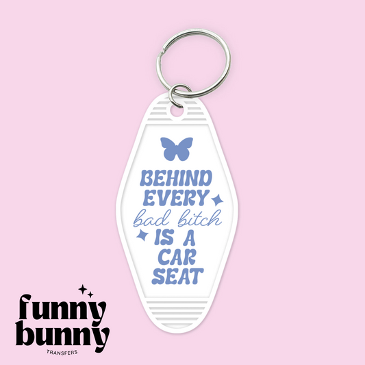 Behind Every Bad Bitch is a Car Seat - Motel Keychain
